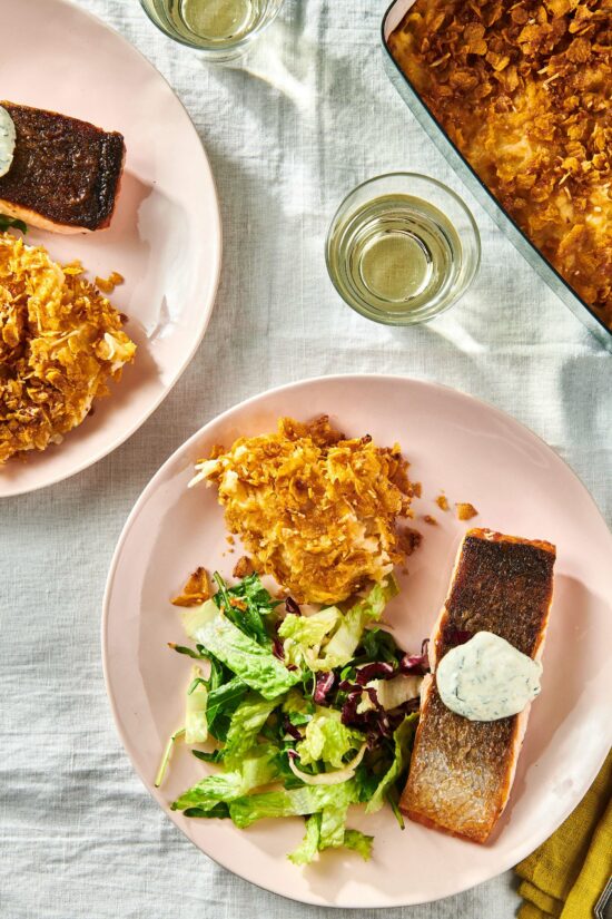 Plate with Funeral Potatoes, salad, and salmon.