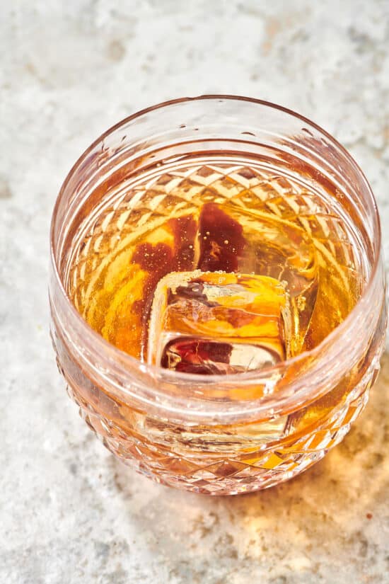 Ice floating in an Old Fashioned.