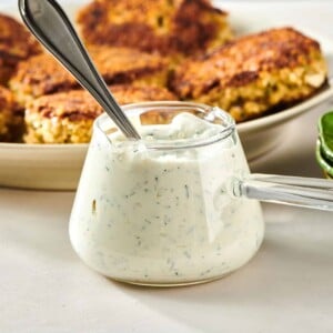 Spoon in a small glass serving cup of Dill Sauce.