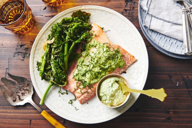 Plate with broccoli rabe, herbed mayonnaise, and salmon.