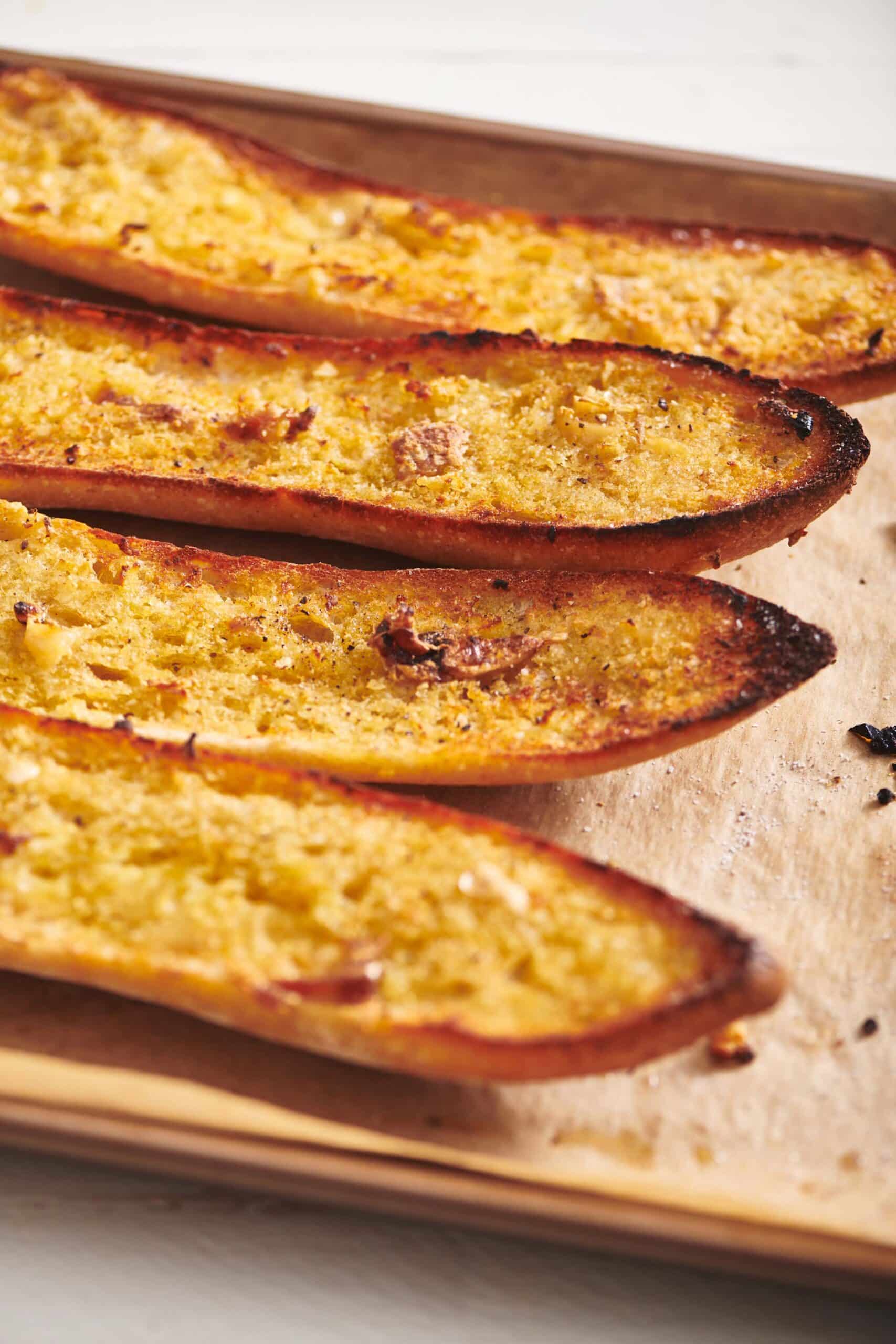 Vegan Garlic Bread on parchment paper.