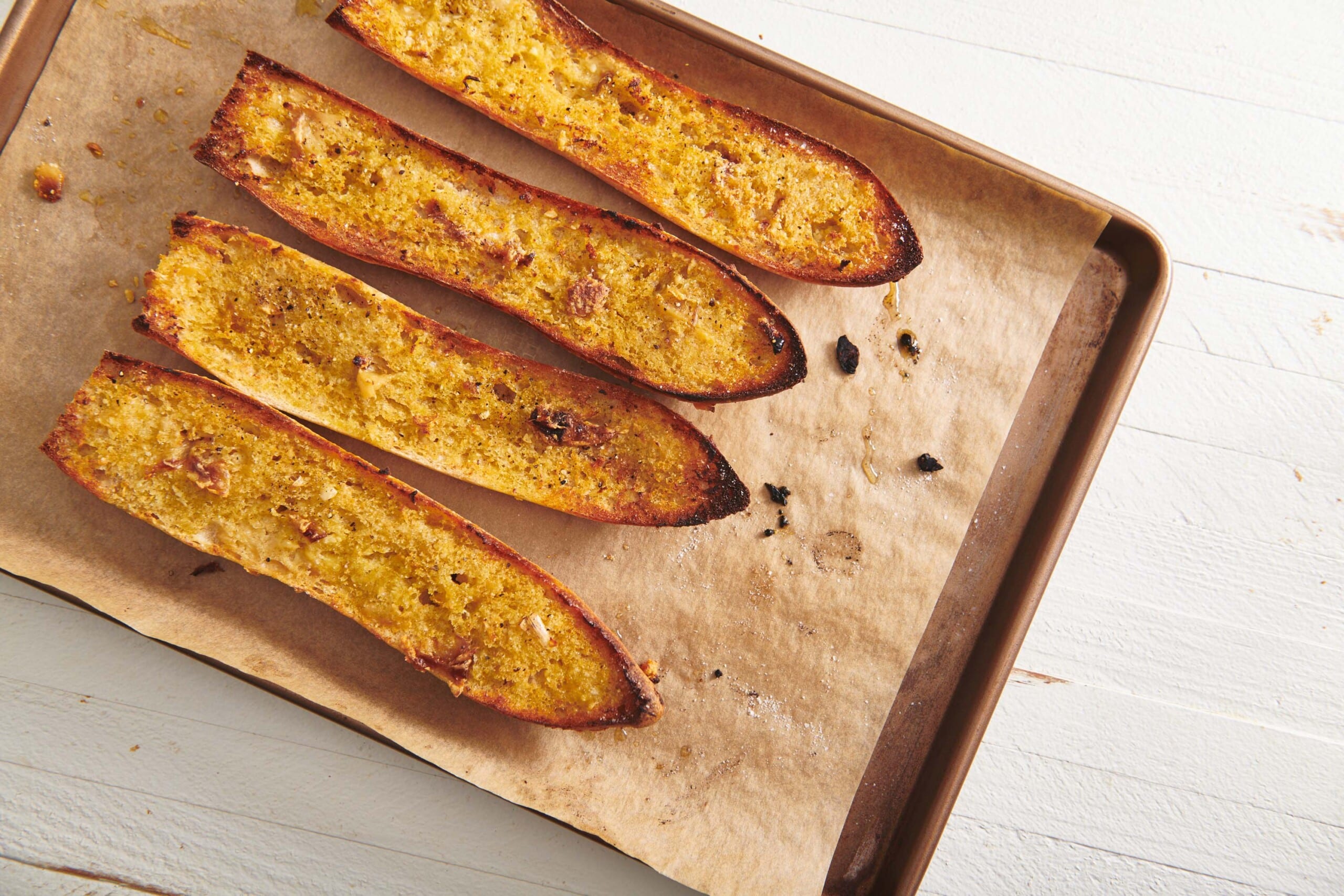 Vegan Garlic Bread on a baking sheet lined with parchment paper.