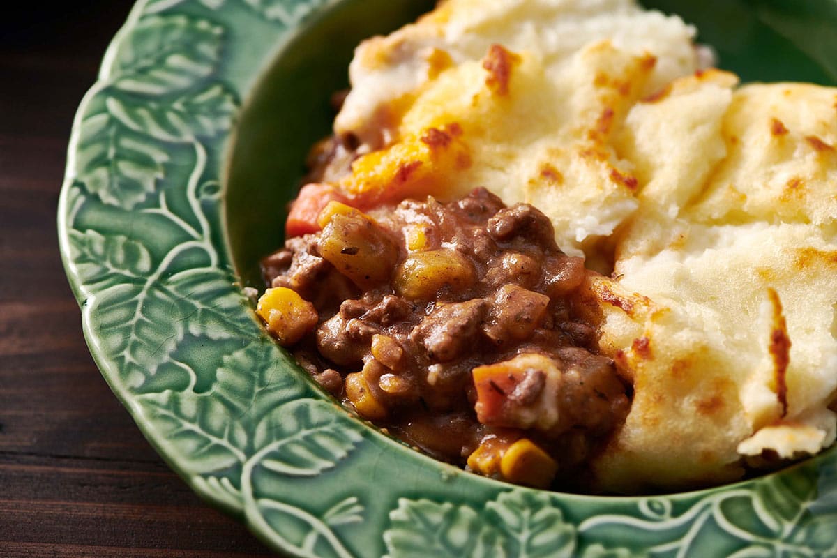 Cottage Pie in a blue-green bowl.