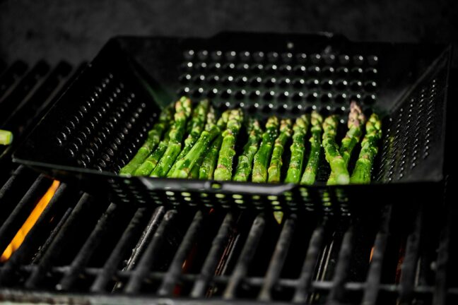 Grilling asparagus in basket