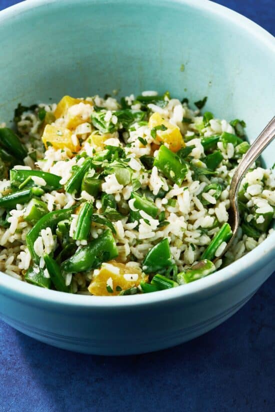 Fork in a bowl of Spring Vegetable and Rice Salad.