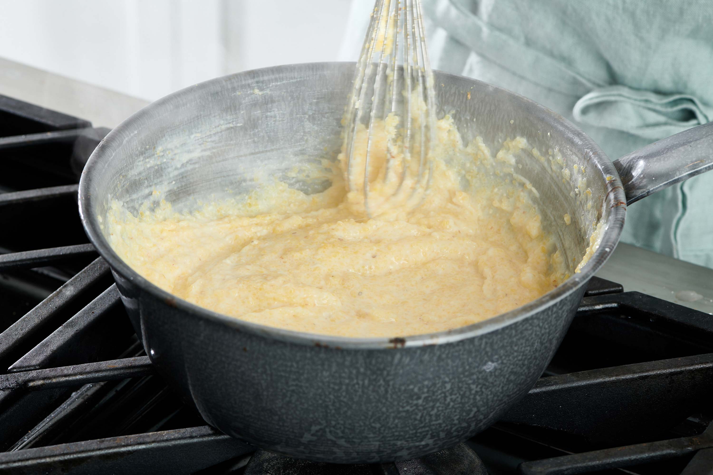 Whisk in a steaming pot of grits.
