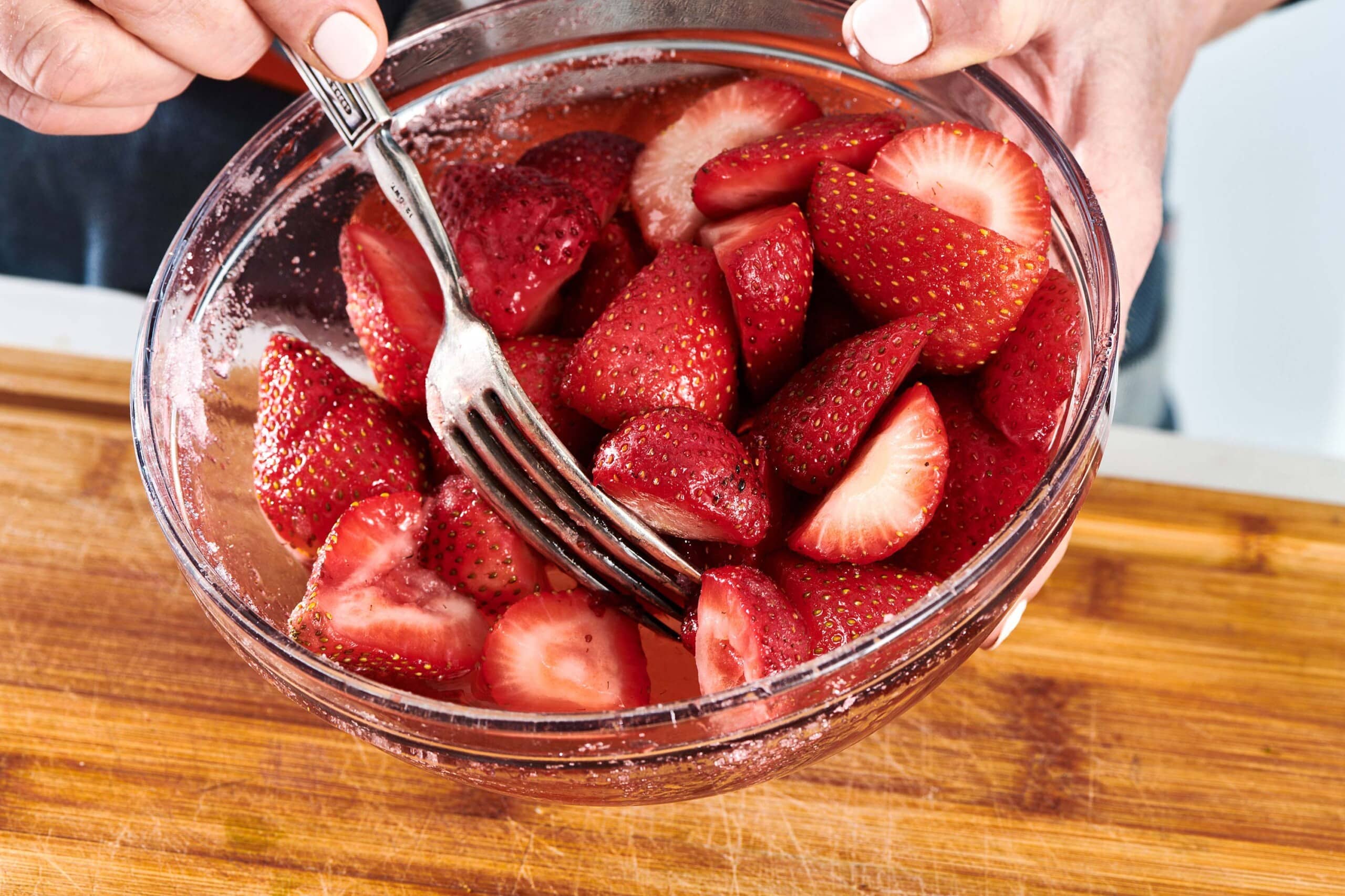 Macerated strawberries in bowl.