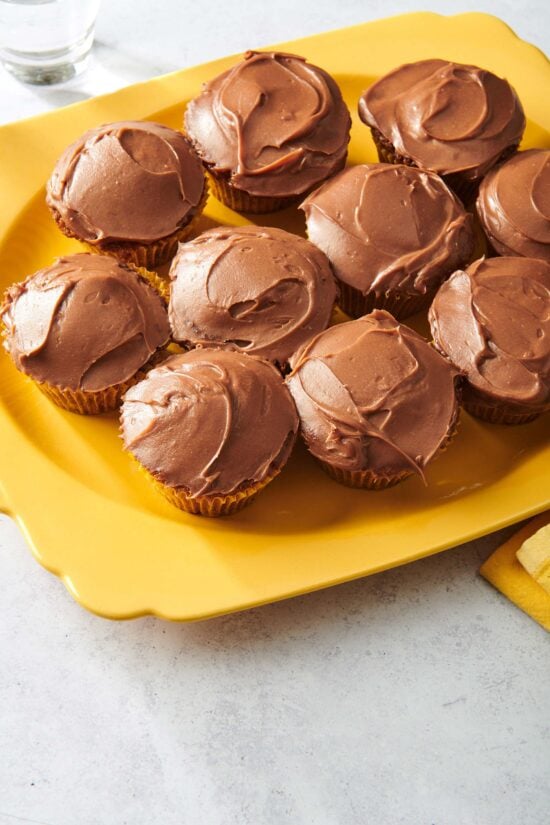 Carrot Cake Cupcakes on an orange plate.