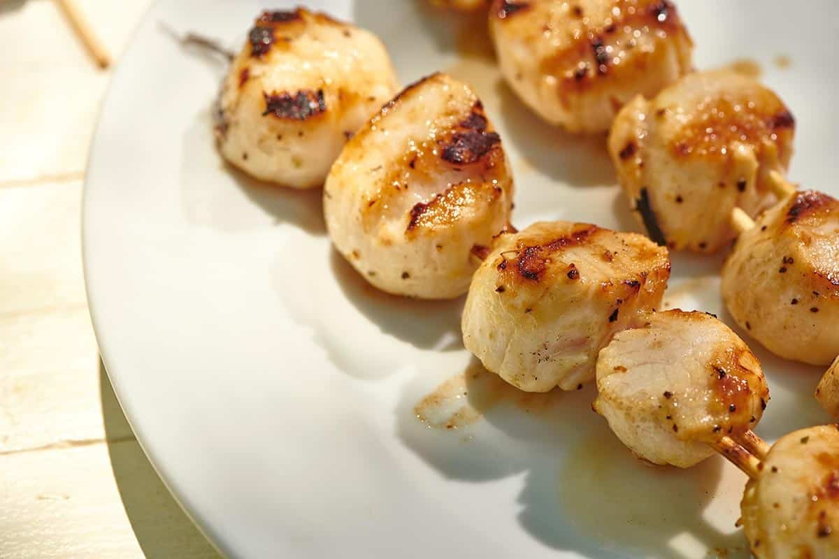 Scallops with grill marks.