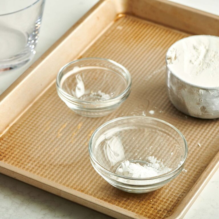 Flour, salt, and baking powder in small glass bowls.