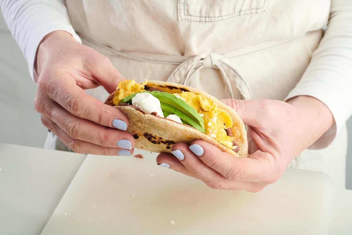 Woman holding a Baleada.