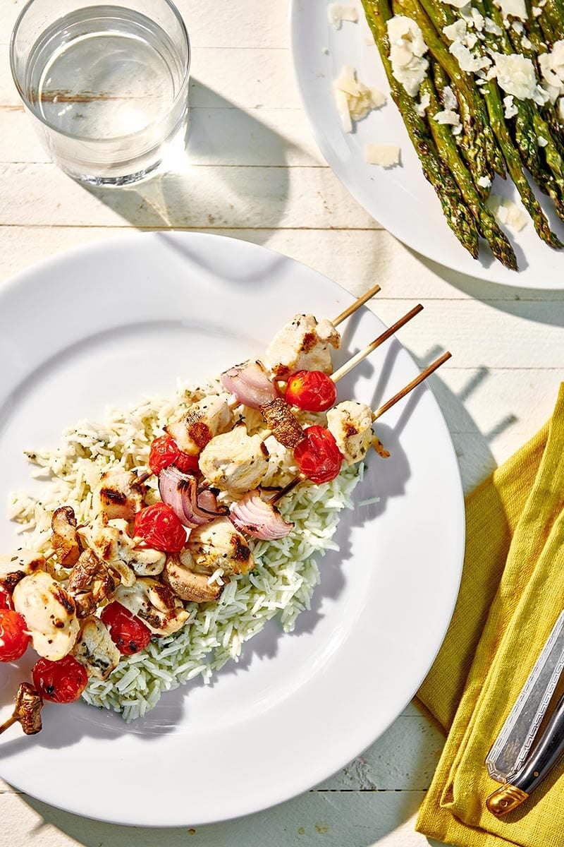 Grilled Chicken Kabobs with Vegetables on picnic table plate.