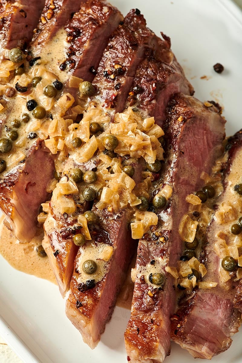 Steak au Poivre on a white plate.
