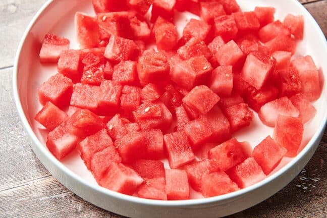 Diced watermelon in a bowl.