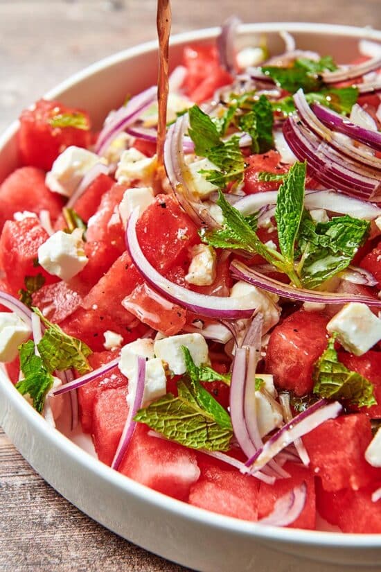 Watermelon Feta Salad topped with mint leaves.