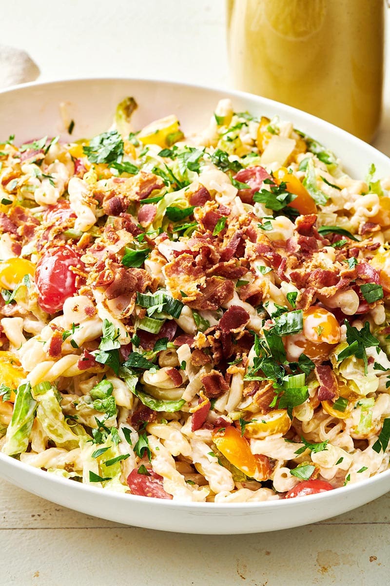 Colorful BLT Pasta Salad in a white bowl.