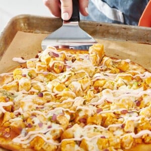 Serving slice of Buffalo Chicken Pizza.