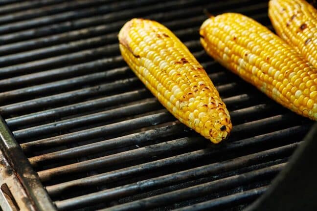 Corn on the Cobs on a grill.
