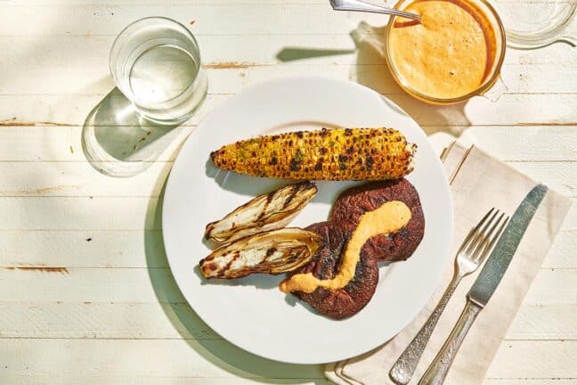 Grilled Corn on the Cob with other grilled foods on a plate.