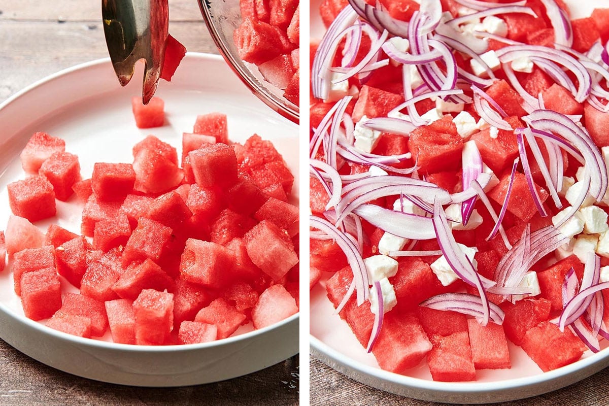 Building salad with cubed watermelon, feta, and red onions in white dish.
