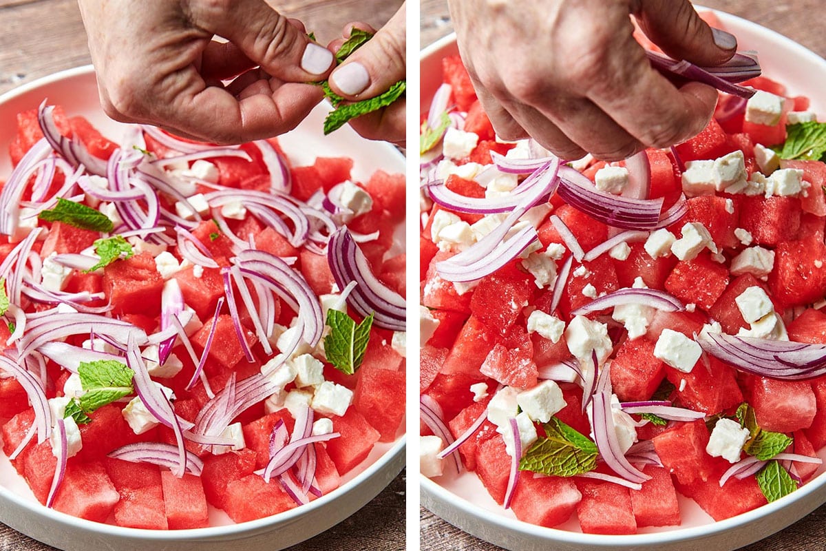 Woman adding fresh mint and red onions to watermelon feta salad.