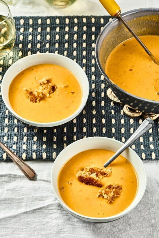 Two white bowls of Pumpkin Curry Soup.
