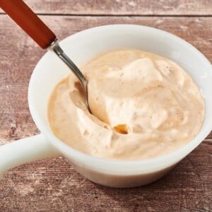 Chipotle Mayo in white bowl with spoon.