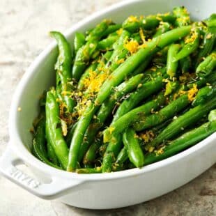 Green Beans with Gremolata in white serving dish.