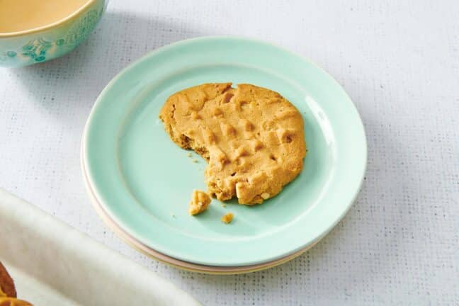 Peanut Butter Cookie with a bite missing on a small plate.