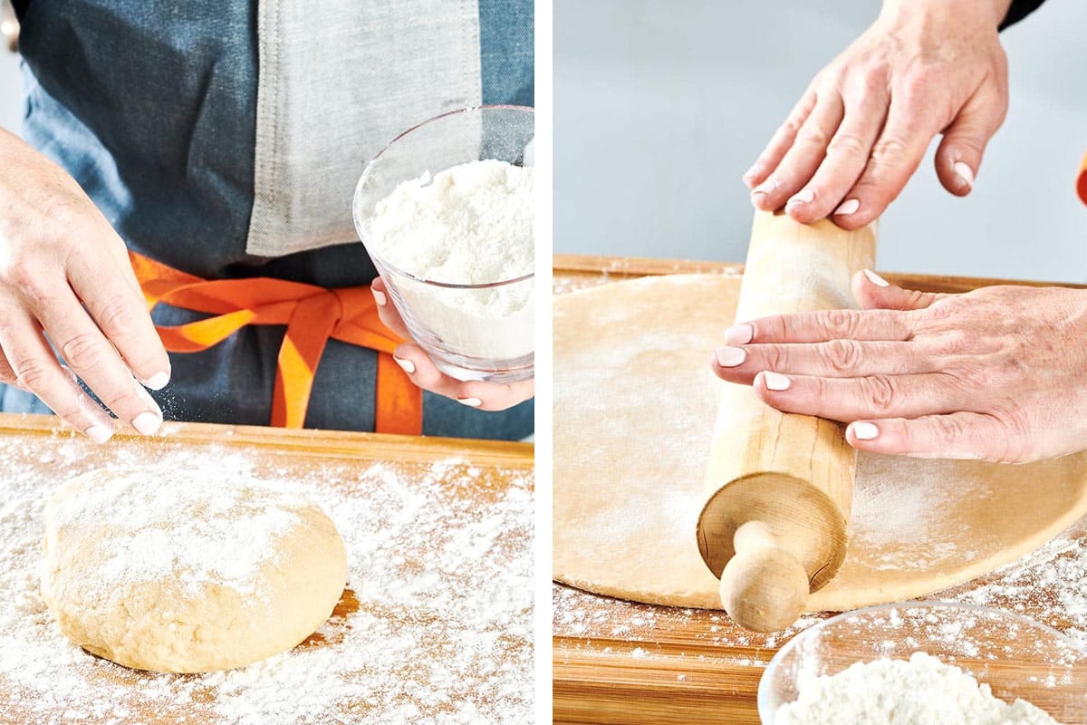 Woman flouring and flattening doughnut dough with a wooden rolling pin.