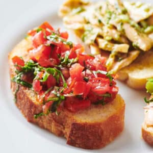 Grilled bruschetta with tomato topping.