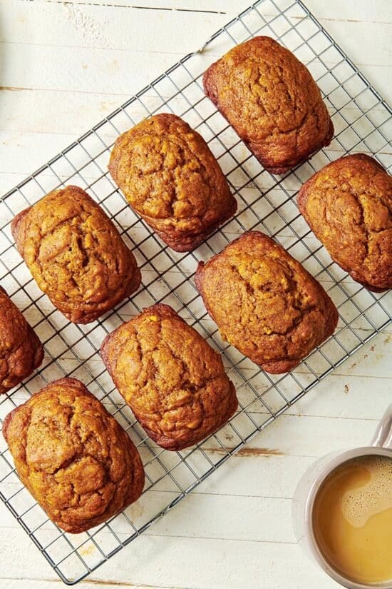 Mini Pumpkin Bread Loaves on a wire rack.