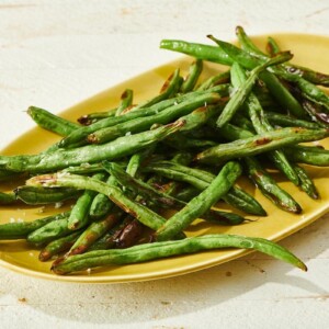 Seasoned Green Beans on an oblong, yellow plate.