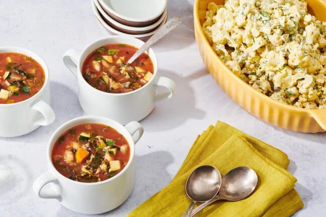 Bowls of Minestrone Soup with creamy salad