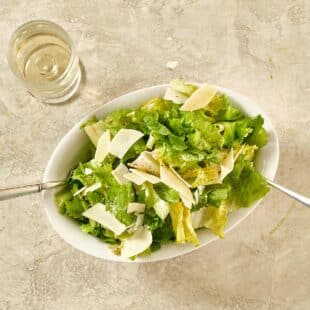 Escarole Salad in an oblong, white bowl.