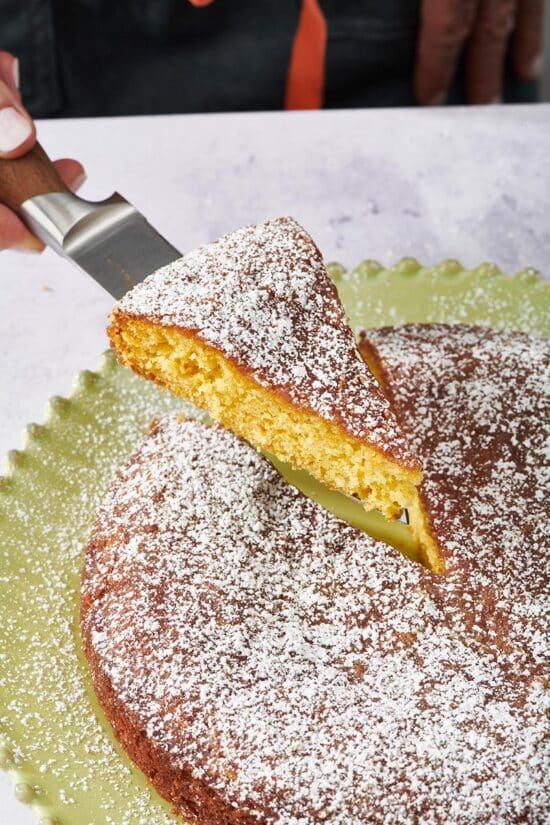 Spatula removing a slice of Orange Cake.