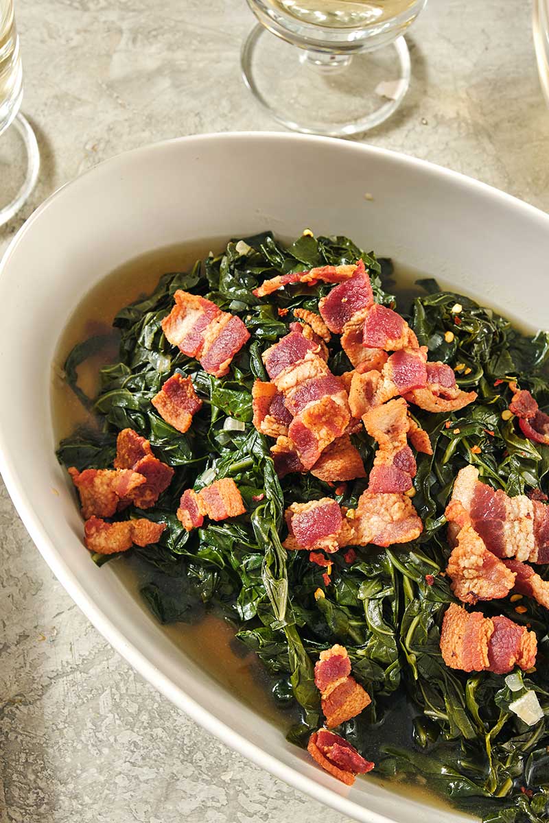 Southern Collard Greens with Bacon in an oblong serving bowl.