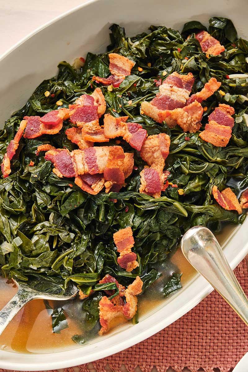 Fork dipping into Southern Collard Greens with Bacon.