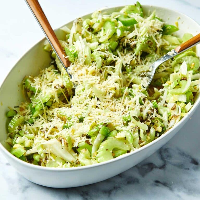 Serving bowl of Celery Salad with two forks.