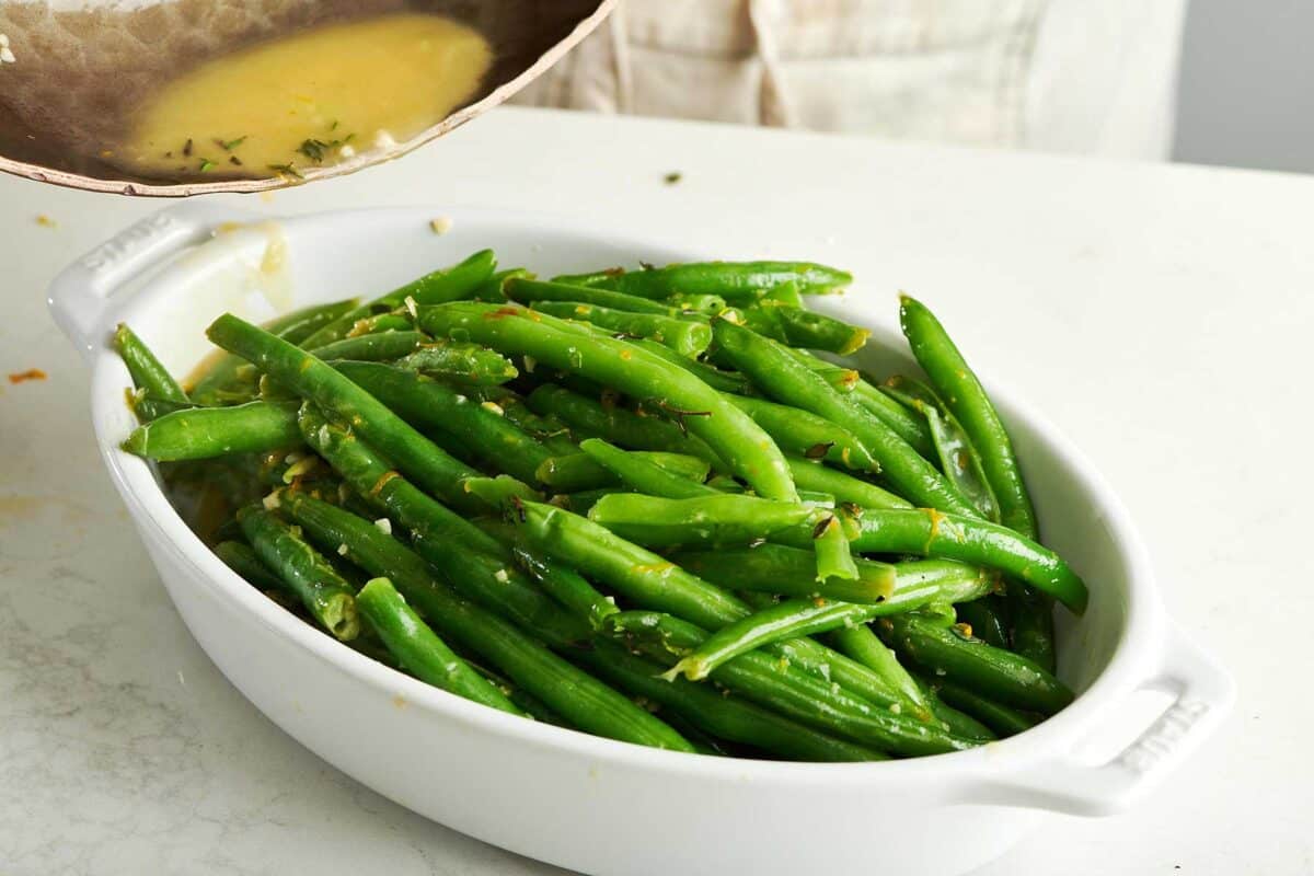 Green Beans with Gremolata in white serving dish.