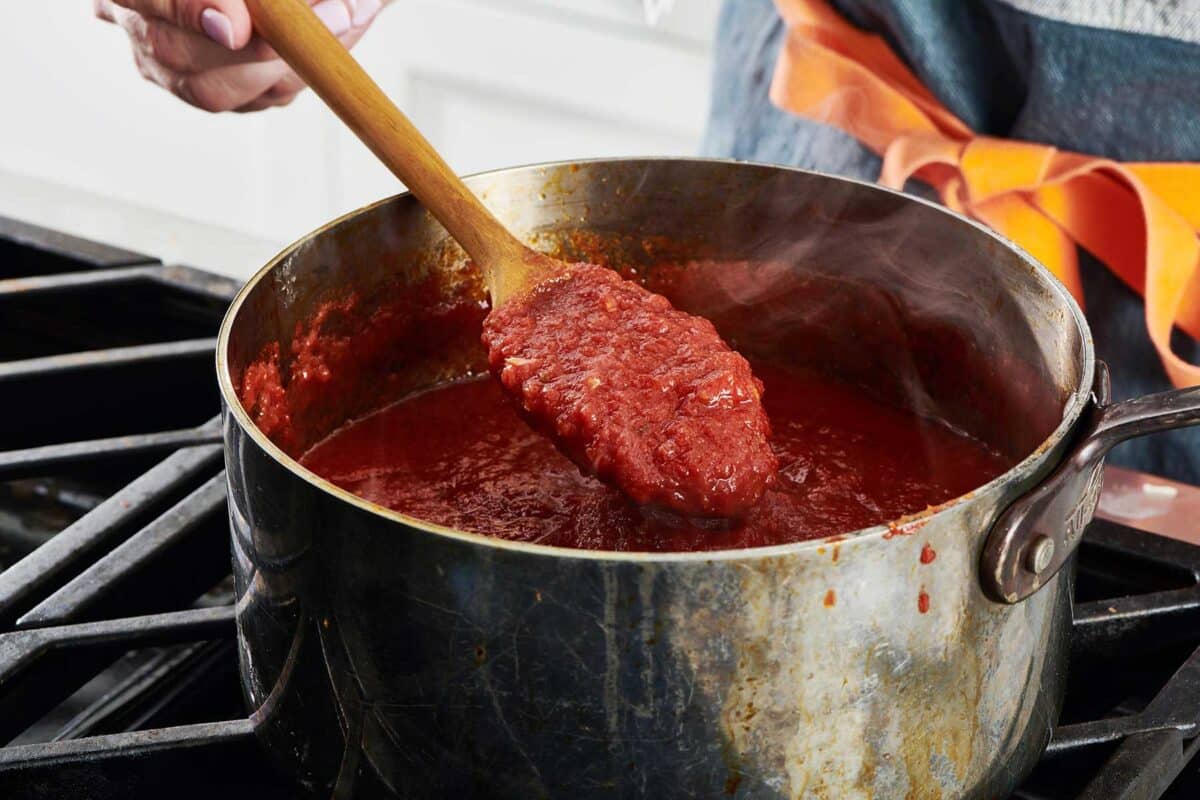 Making Marinara Sauce in pan on stove.