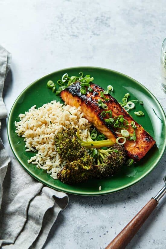 Miso-marinated salmon on plate with broccoli and rice