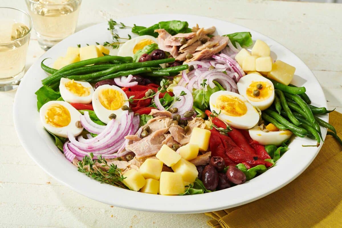 Colorful Nicoise Salad on a large white plate.