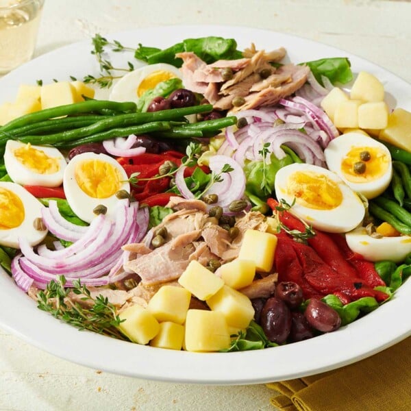 Colorful Nicoise Salad on a large white plate.