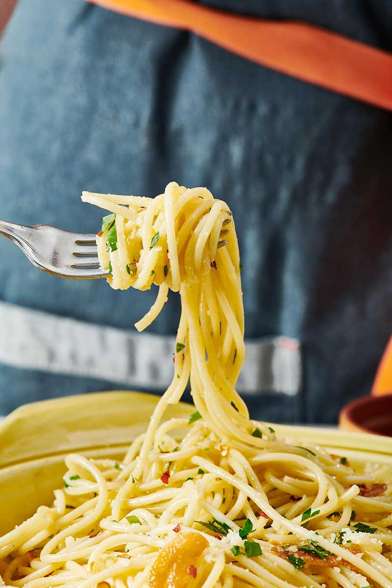 Twirling Pasta Aglio e Olio with fork.