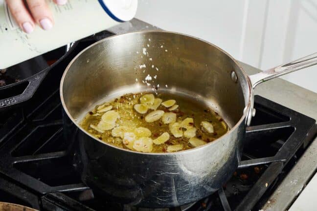Seasoning oil with aromatics for sauteed escarole