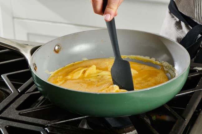 Stirring scrambled eggs with spatula