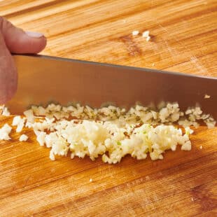 Mincing garlic with chef knife