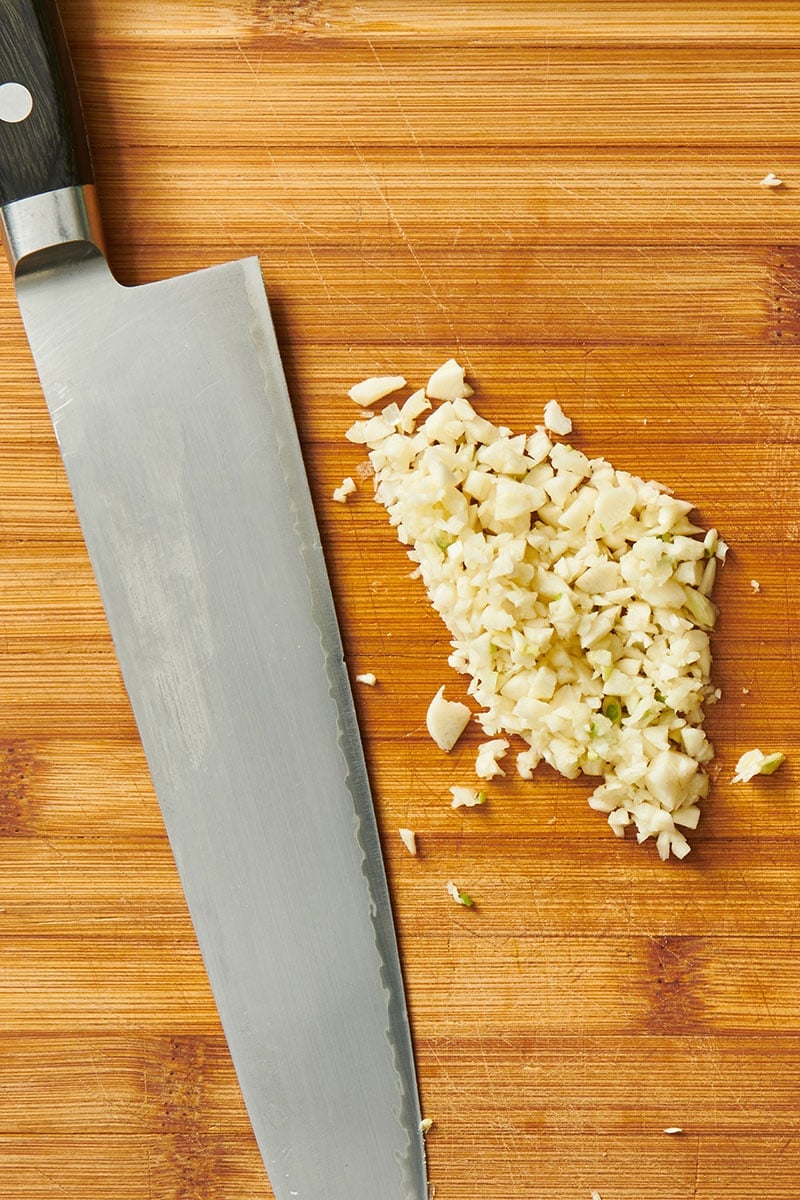 Finely minced garlic and knife.