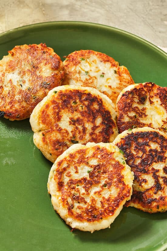 Fried potato pancakes on green plate